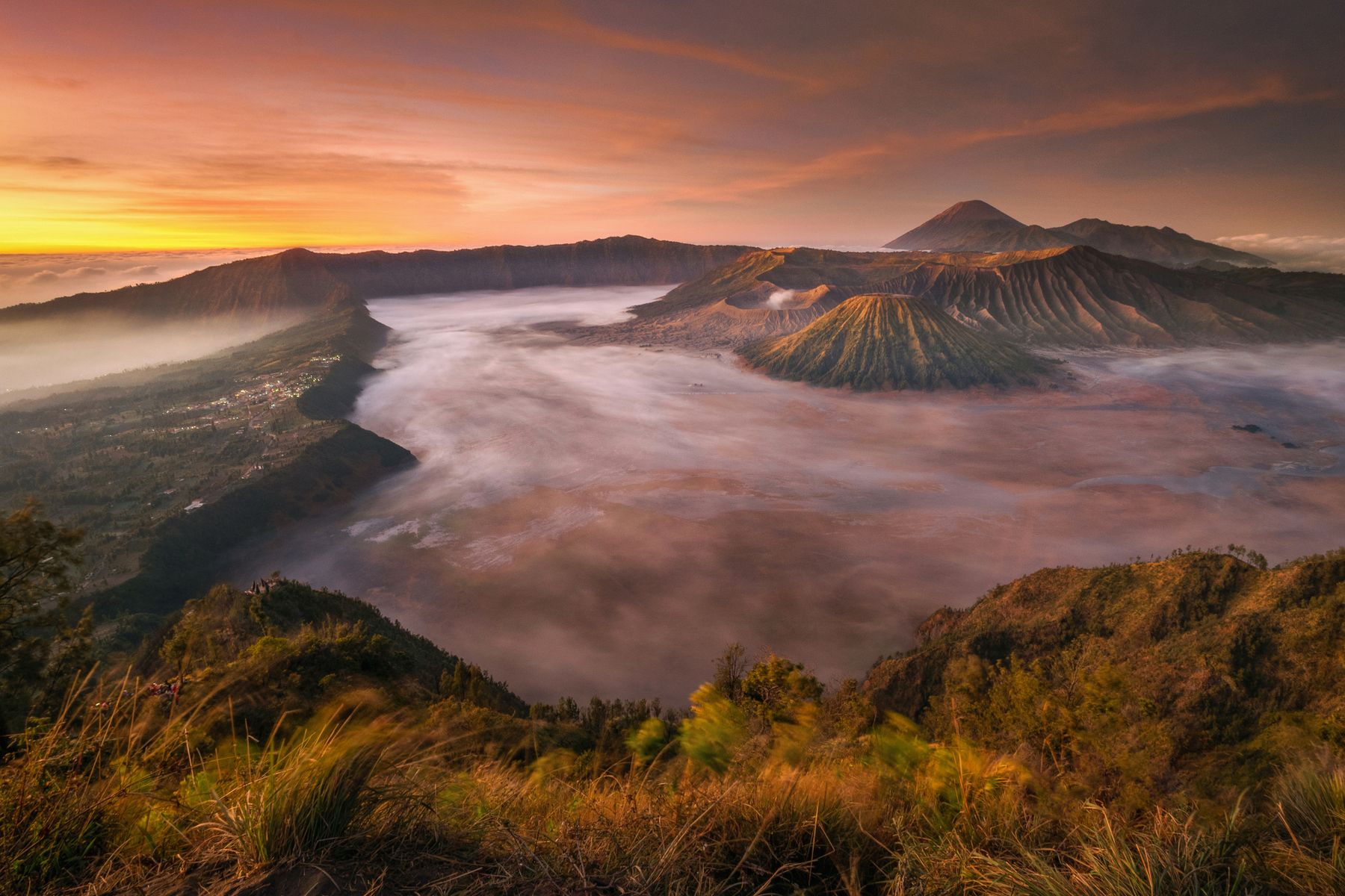 Indonesian volcano glowing at sunrise